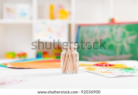 Colorful objects on a preschool art table