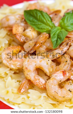 A plate of shrimp scampi farfalle pasta