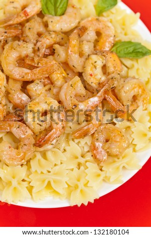 A plate of shrimp scampi farfalle pasta