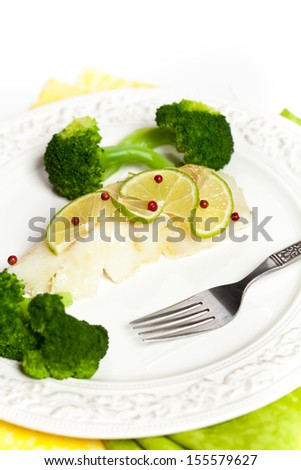Dinner Plate with White Fish and Steamed Broccoli