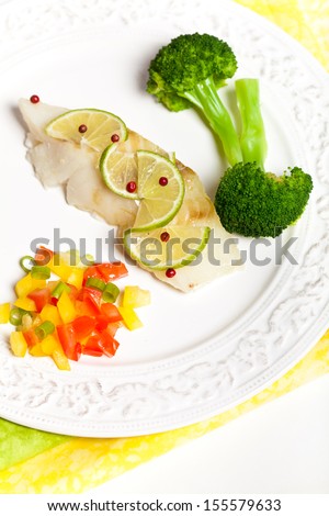 Dinner Plate with White Fish and Steamed Broccoli