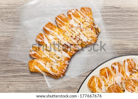 Bear claw pastry with sliced almonds and sugar