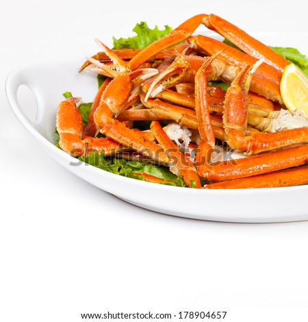 Crab Legs with fresh lemon slices and butter sauce