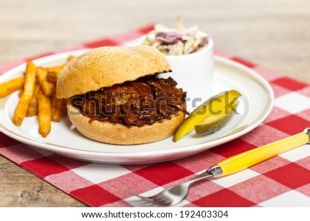 Pulled Pork Sandwich with Potatoes. Selective focus.