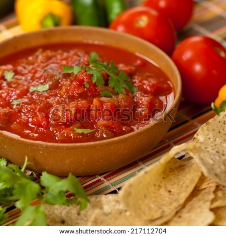 Bowl of red salsa with tortilla chips