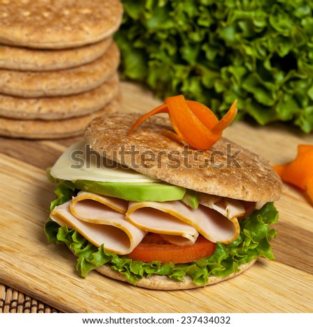 Turkey Sandwich on Whole Wheat Thin Sandwich Roll. Selective focus.