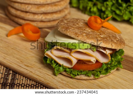 Turkey Sandwich on Whole Wheat Thin Sandwich Roll. Selective focus.