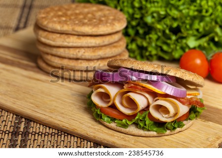 Healthy Turkey Sandwich on Whole Wheat Thin Sandwich Roll. Selective focus.