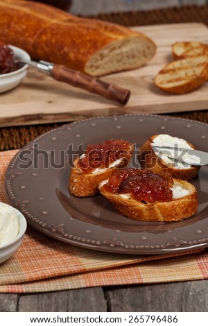 Breakfast with bread and fig jam. Selective focus.