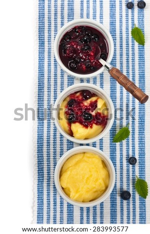 Banana Vanilla Pudding with Blueberry Compote. Selective focus.