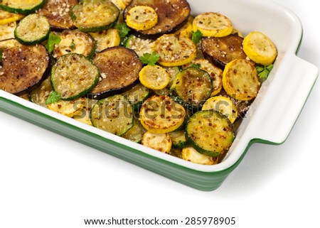 Sauteed Vegetables Eggplant, Squash, and Zucchini with Parmesan Cheese on white background. Selective focus.