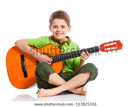 Cute boy with classical guitar Isolated on white background Cute boy with classical guitar Isolated on white background
