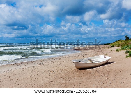 Panorama of the beautiful scenic view of storm Baltic sea with boat, Palanga