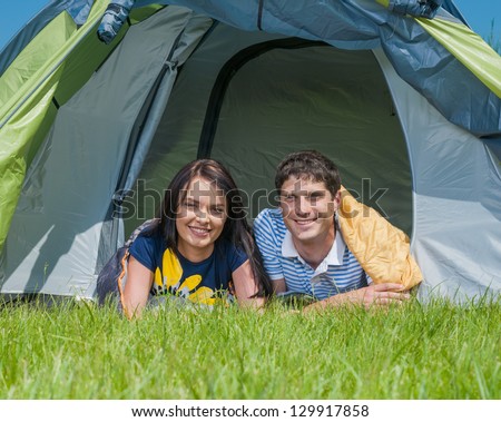 Holiday camping - Man And Woman Couple Camping In A Tent In The Countryside