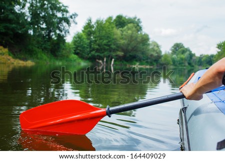 Red paddle for white water rafting and kayaking