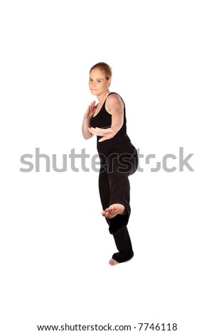 Karate kick in aerobics clothing on one foot