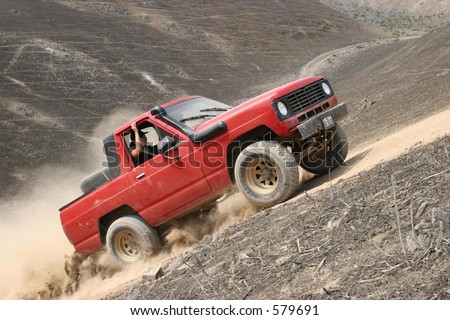 4 x 4 truck blasting up a hill at an offroad training South of Lima, Peru