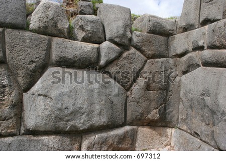 Wall at the Sacsayhuaman fortress above Cusco, Peru. If you look closely, you can see the shape of a Llama (reclining, head top right hand side)