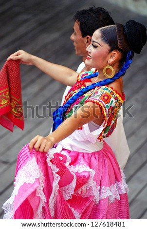 RIVIERA MAYA, CANCUN, MEXICO - JUNE 20: Unidentified Mexican dancers perform in ethnic costumes on stage at the Xcaret Park in Riviera Maya, Cancun, Mexico on June 20, 2012.