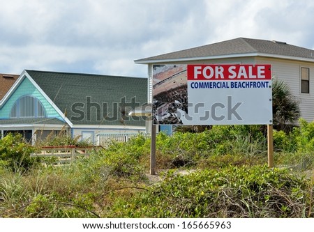 Commercial beachfront property for sale sign at Florida, USA.