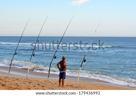 Man Surf Fishing on the east coast of Florida, USA.