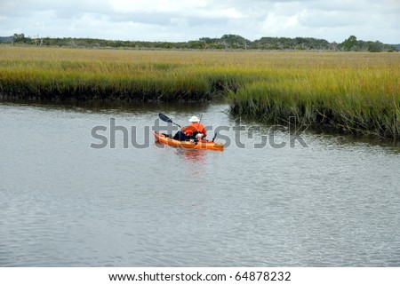 retired senior citizen kayaking on the st johns river near st augustine florida