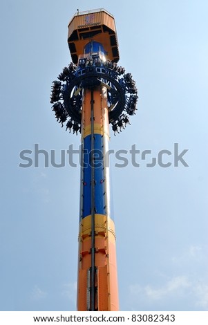 People free falling from tower ride at amusement park