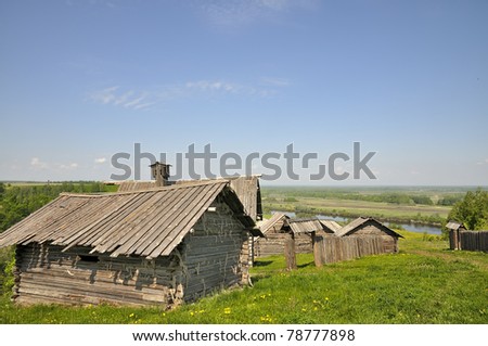 Russian village. The old traditional village on the riverbank. The village is on a high hill.