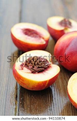 Juicy peaches on a wooden table.