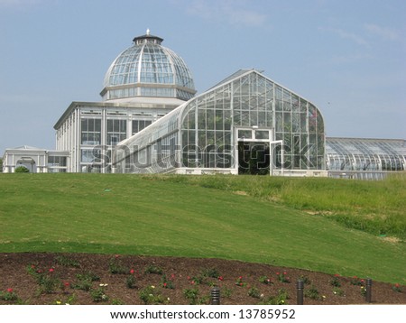 Large glass conservatory onto a hillside of lawn