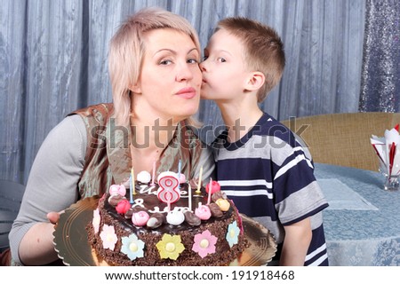 mother and child with the birthday cake