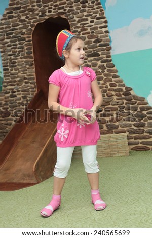 pretty little active girl in pink dress