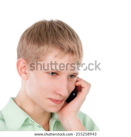 young blond smiling guy speaking the mobile phone