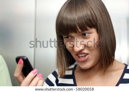 young beautiful girl angry with phone call