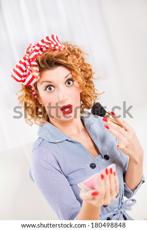Portrait of surprised retro style woman/housewife with makeup