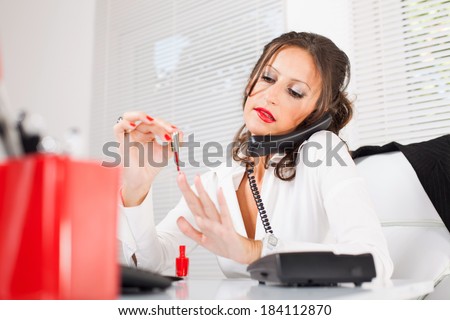 http://image.shutterstock.com/display_pic_with_logo/531913/184112870/stock-photo-attractive-sexy-secretary-lacquered-nails-in-the-office-and-talking-on-the-phone-and-biting-lips-184112870.jpg