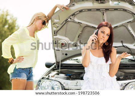 Concerned young tourist woman making phone call and ask for help because of Car troubles.