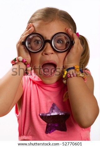 stock photo Little girl wearing big round glasses and making a silly 