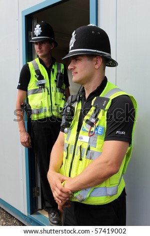 Two British Police Constables in uniform standing together