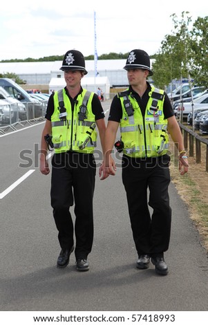 Two British Police Constables on patrol and in uniform