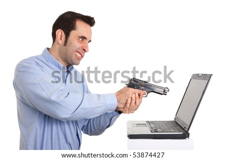 stock photo a man angry and holding a gun ready to shoot against his laptop he has had some trouble with 53874427 - ~!~Ur Attendence plz~!~