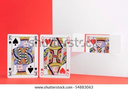 The queen of hearts is caught cheating with the king of spades.