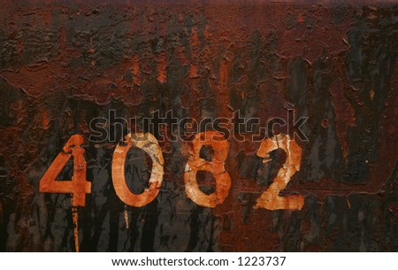 No 4082 on black/brown rusted background.