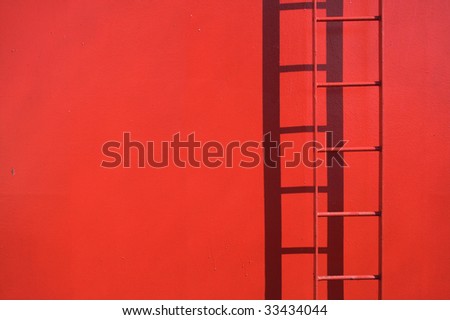 Fixed red ladder with copy space. Detail from a ship. Ladder in focus.