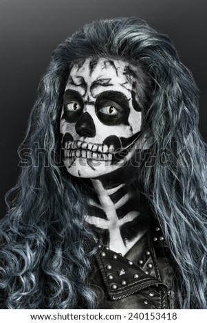 Women painted as skeleton. Halloween theme