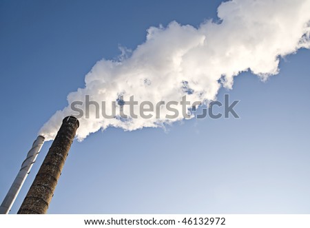 Powerplants polluting air, large smoke clouds from towers