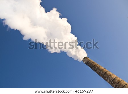 Power plant polluting air, large smoke clouds from towers