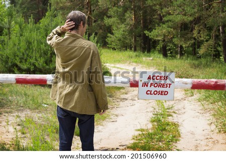 Man reading banning visit forest in inflammable period