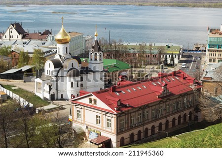 RUSSIA, NIZHNY NOVGOROD - MAY 01, 2014: View of the Church of Our Lady of Kazan to the Kremlin wall. This church was destroyed during the Soviet era and the newly restored