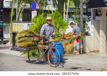 PHUKET, THAILAND - CIRCA MAR 2015: Sellers of brooms in a Thai village. Businesses small , which employed many Thai people, is thriving in Thailand